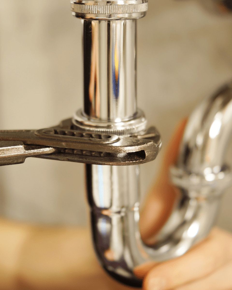 Plumber fixing pipe